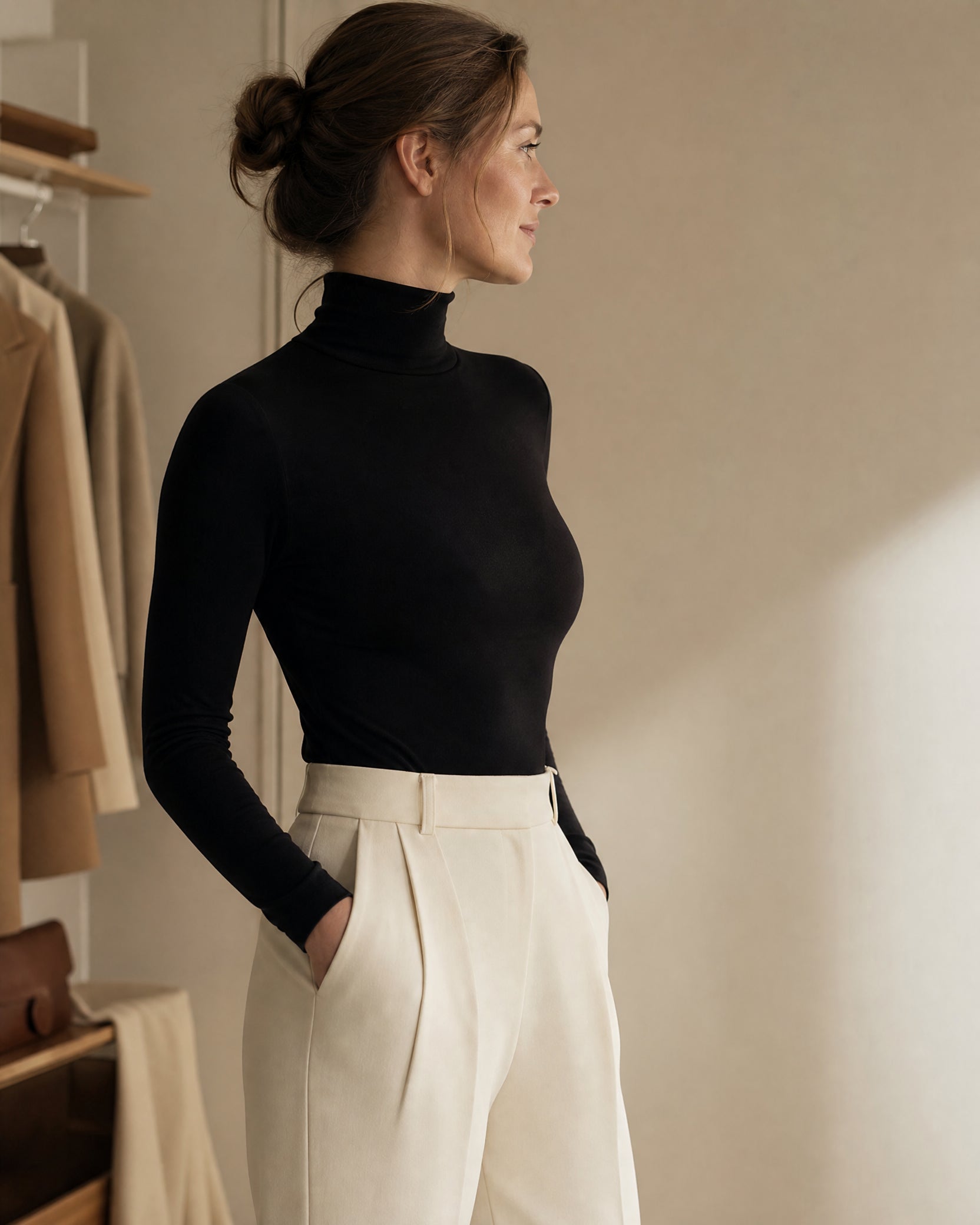 Woman in a black top with a smooth, natural silhouette